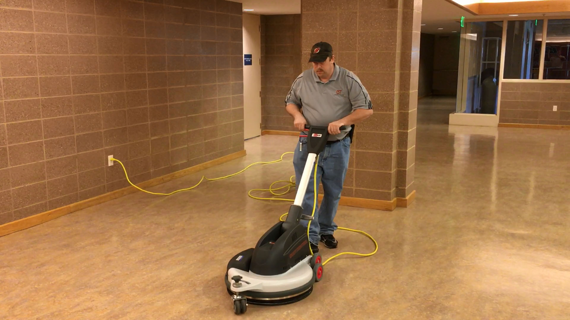 Floor buffing services example with a cleaning team member