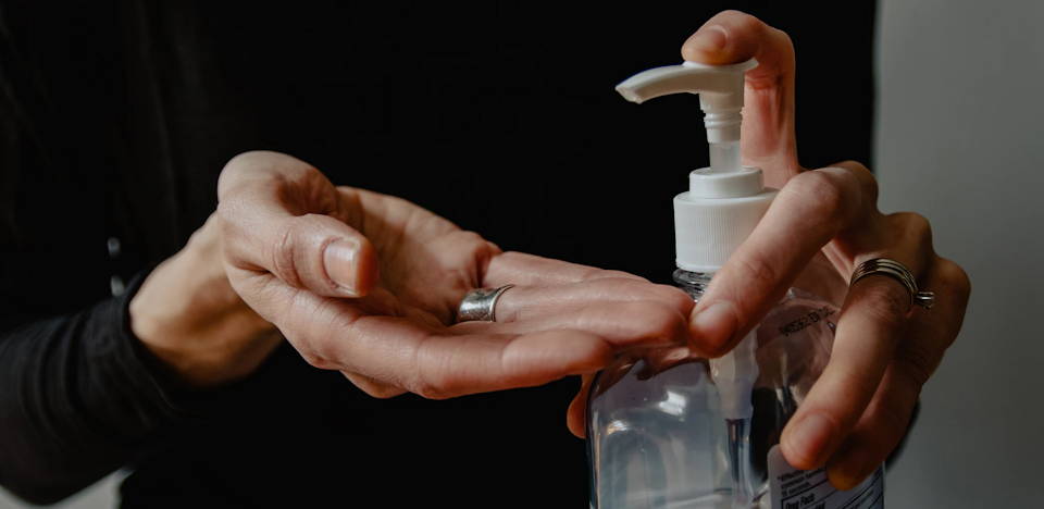 Applying hand sanitizer via pump