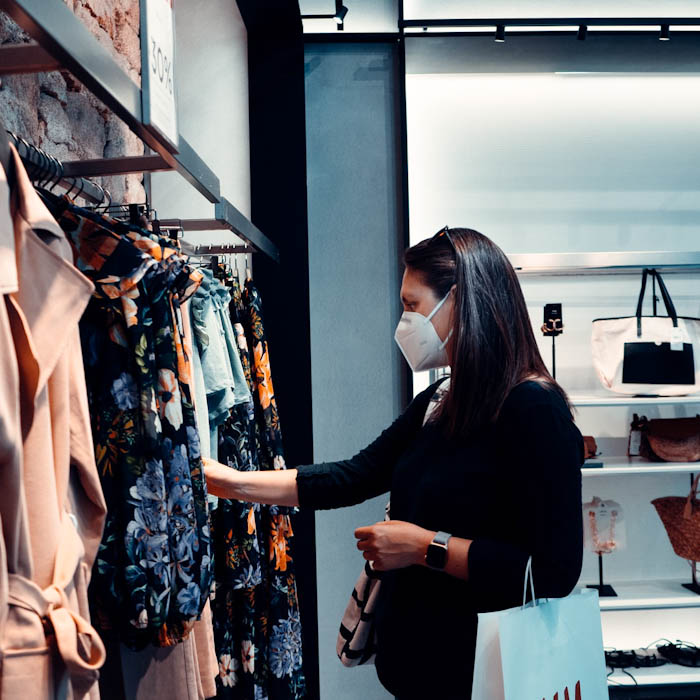 Retail shopper with mask, appreciating the cleanliness