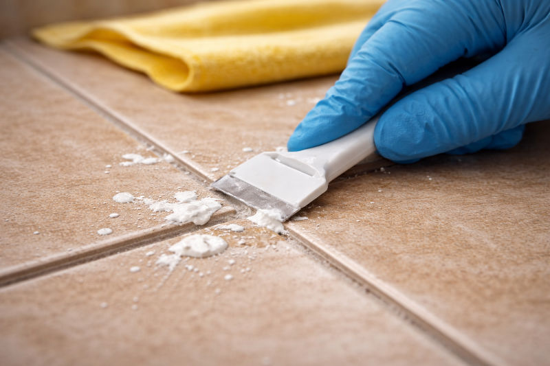 Gently scraping paint off of tile flooring
